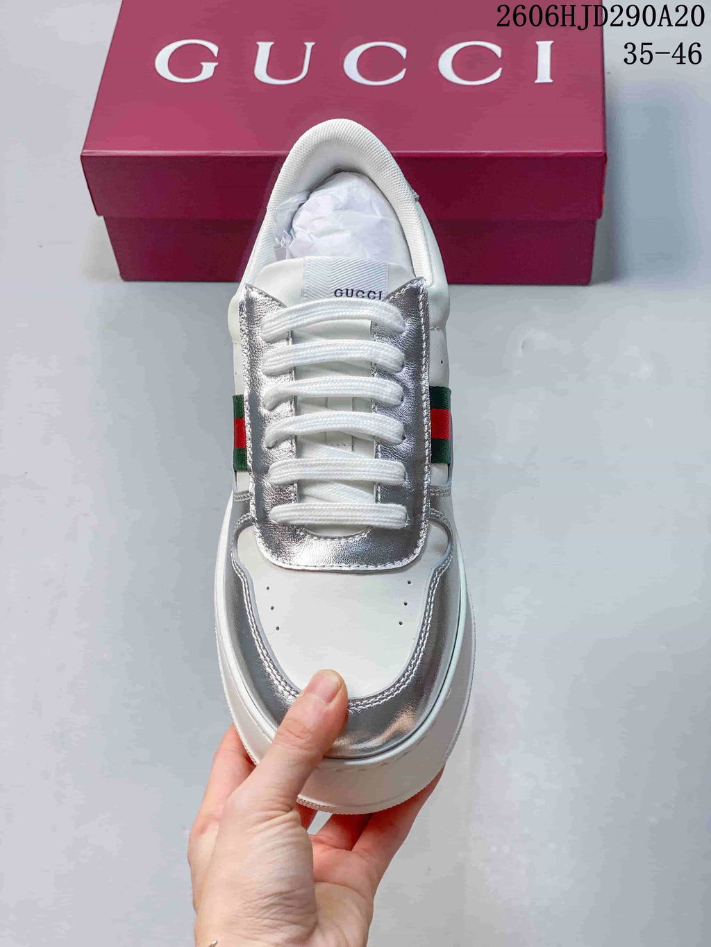 Top view showing the sneaker's laces, silver overlays, and rounded toe