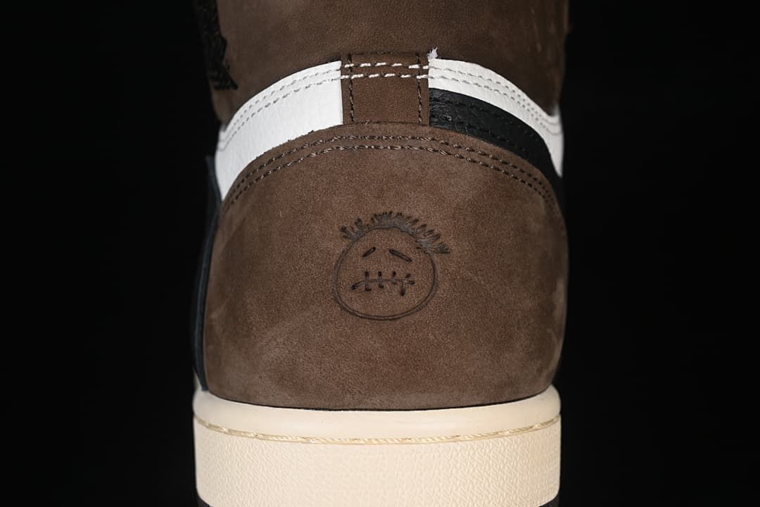 Rear heel detail with brown panel and embossed graphic