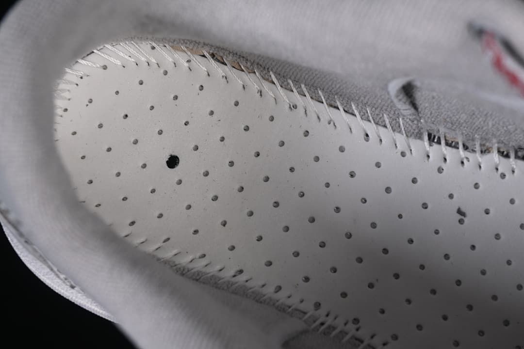 Close-up of perforated interior footbed and stitching
