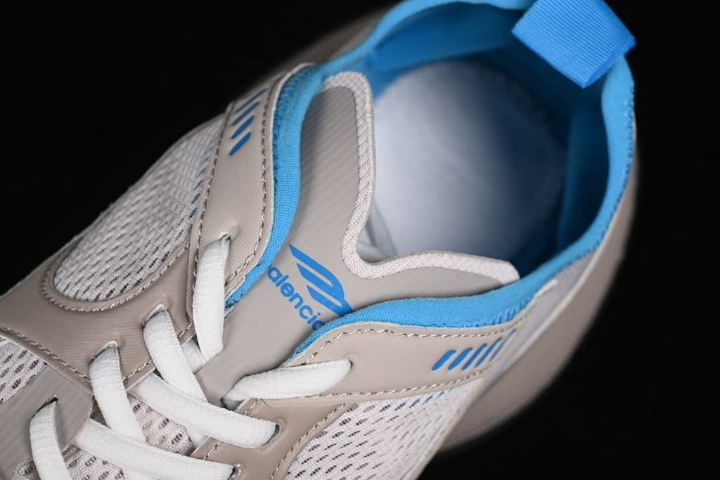 Top view showing the laces, tongue branding, and blue lining