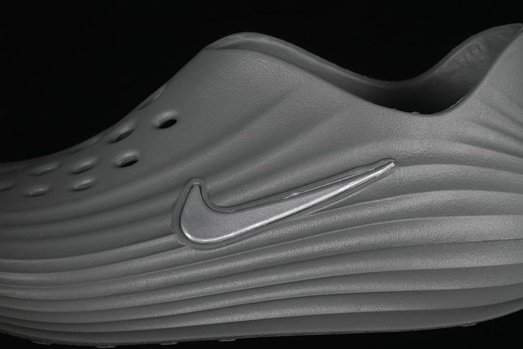 Close-up of the raised side Swoosh and sculpted ridges