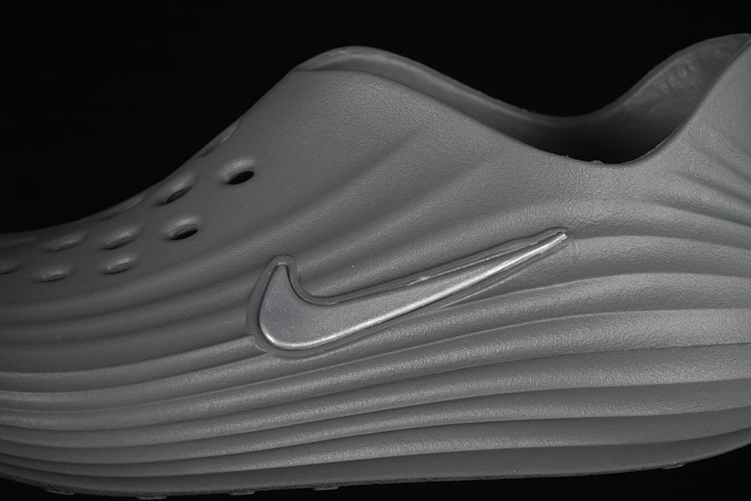 Close-up of the raised side Swoosh and sculpted ridges