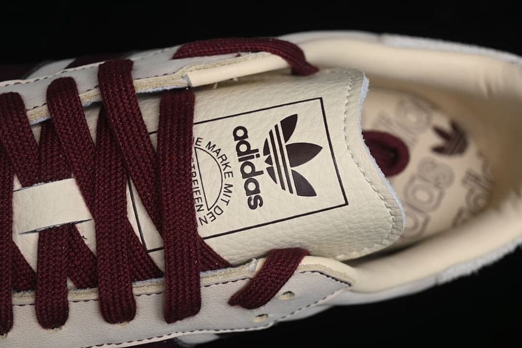 Close-up of the branded tongue and burgundy laces.