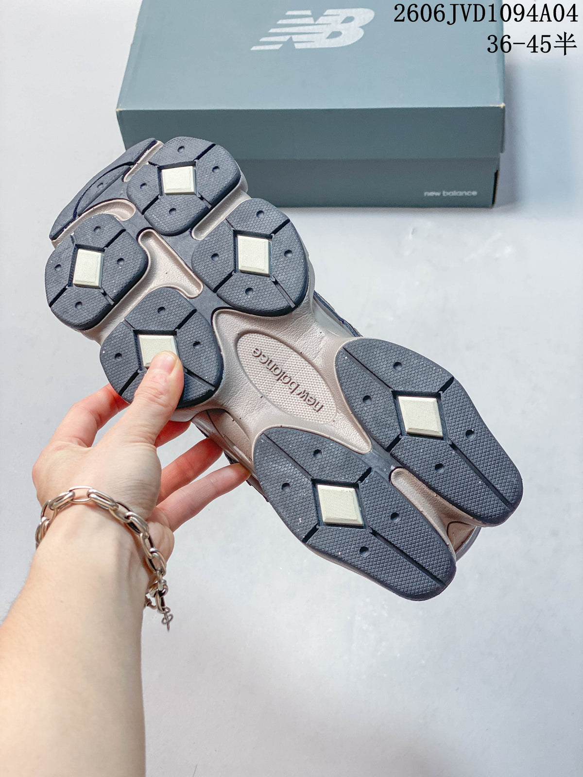 Close-up of the segmented outsole on a taupe and gray sneaker