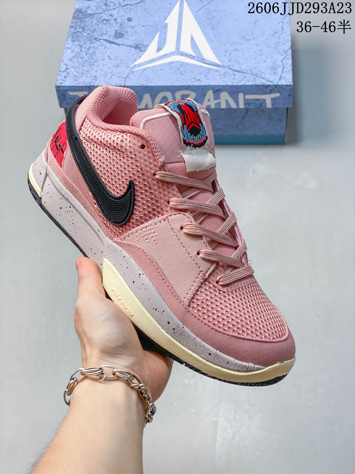 Pink Nike Ja 1 EP shoe with black side logo and contrasting midsole.