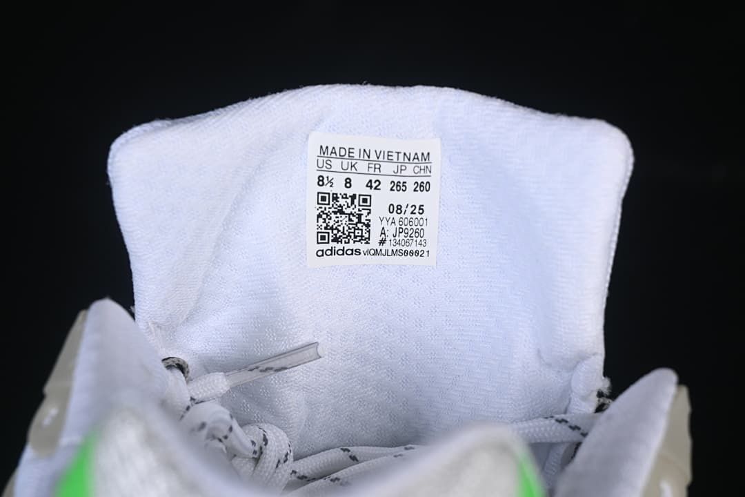 Sneaker tongue label showing size information and style code JP9260.