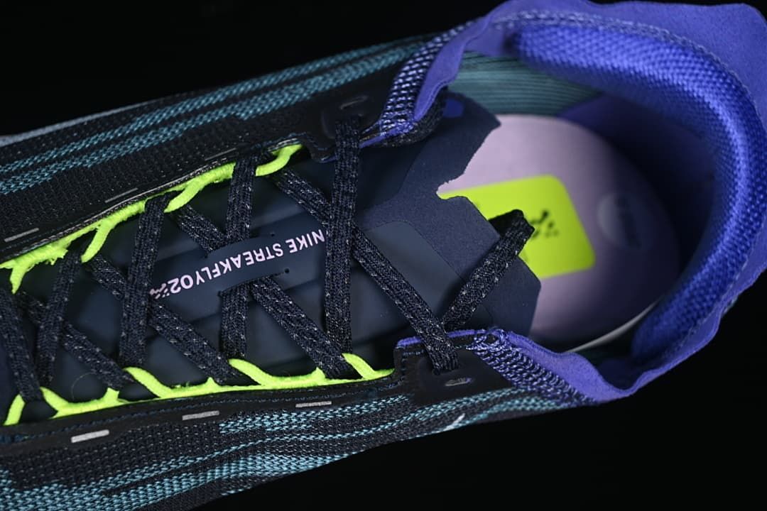 Top-down close-up of the laces and shoe opening.