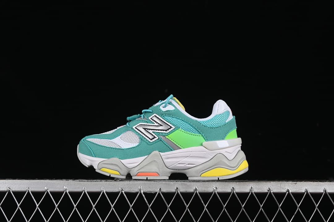 Side view of teal, white, lime, and gray New Balance 9060 kids sneakers