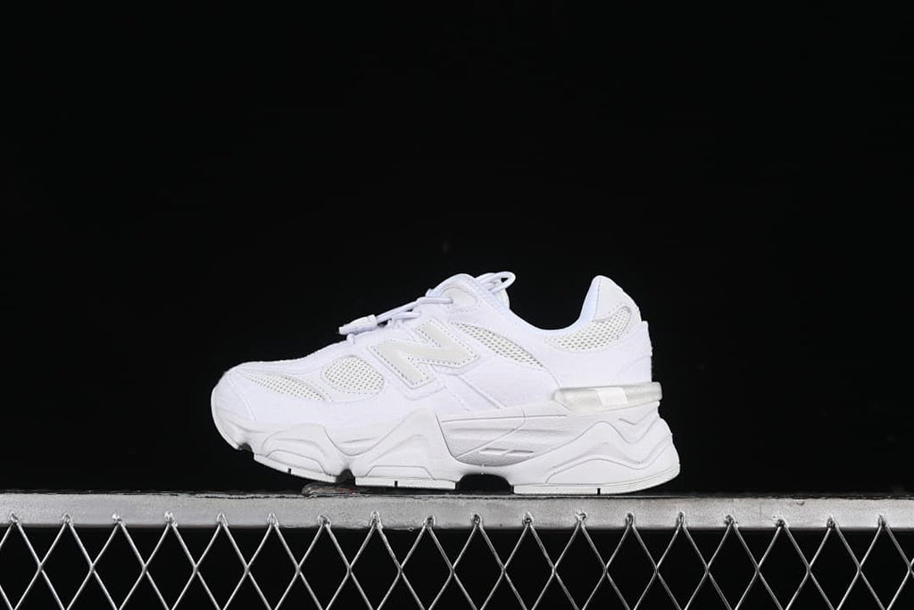 White New Balance kids sneakers shown in side profile.