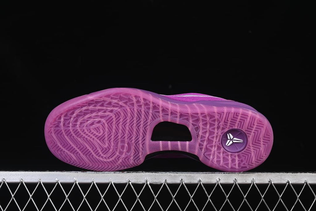Underside view showing the translucent purple tread pattern