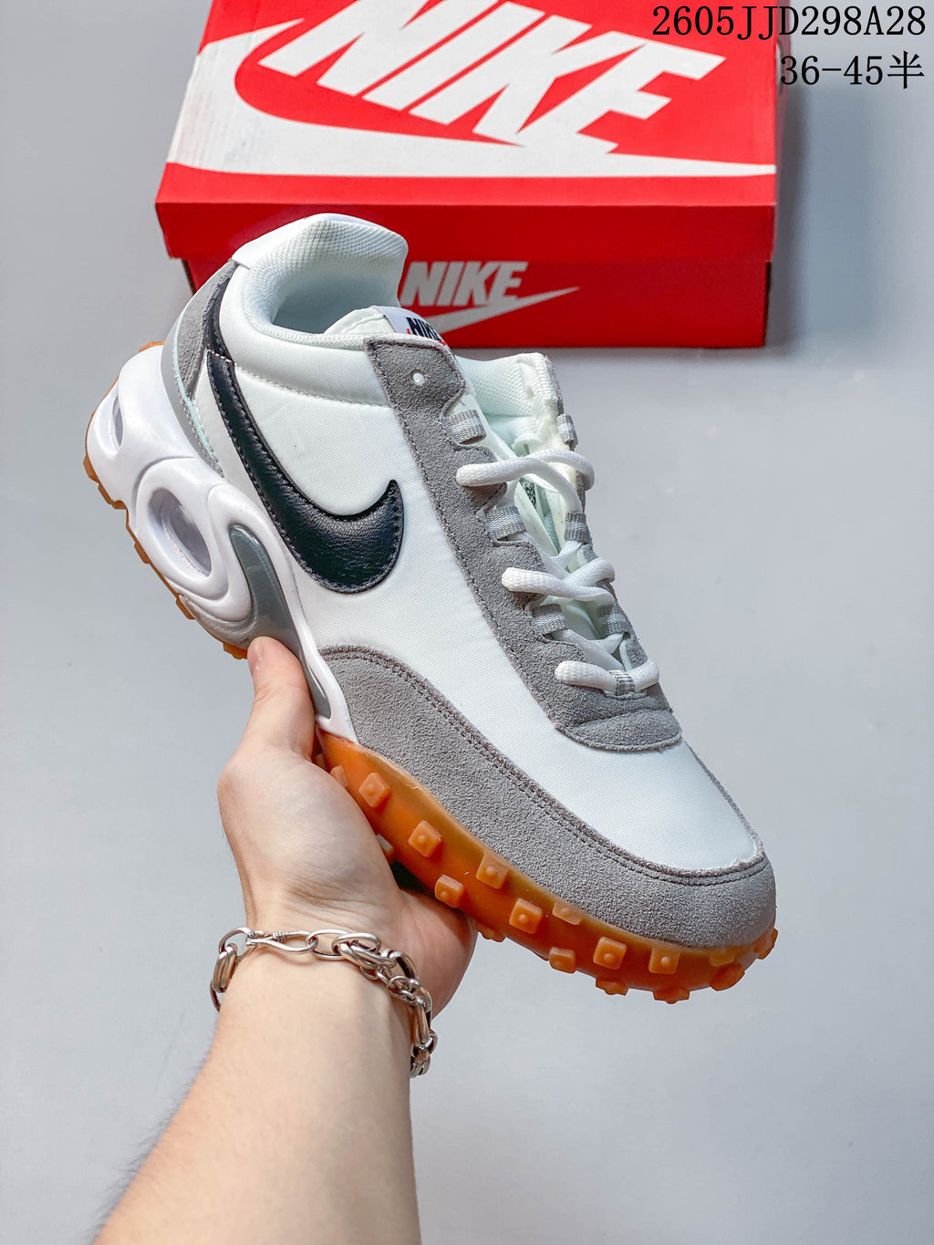 White and gray Nike Air Max Waffle SP low-top sneaker with a gum-colored outsole.