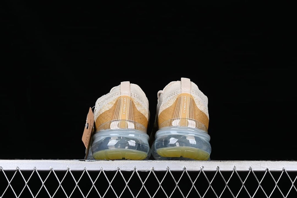Rear view of both shoes showing heel details and transparent sole units.