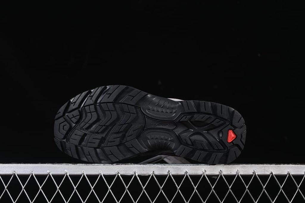 Underside view showing the black lugged outsole