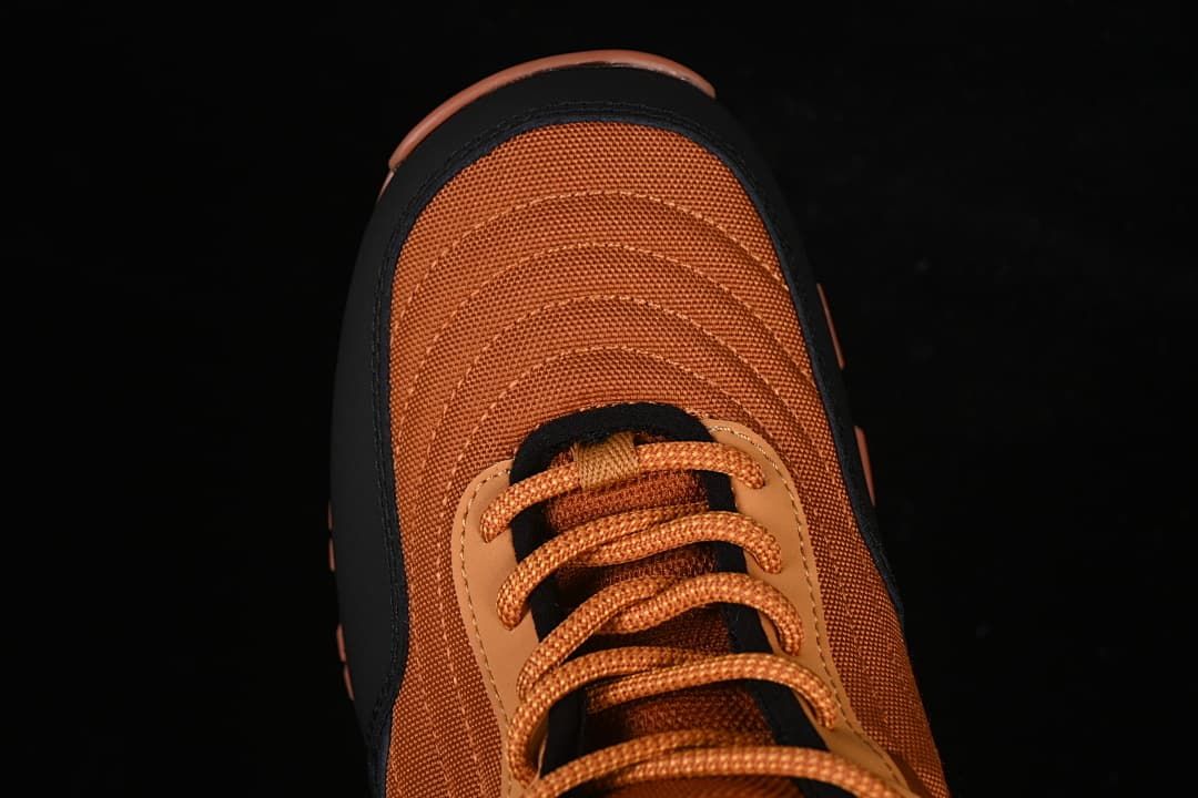 Top view of the orange boot toe and laces