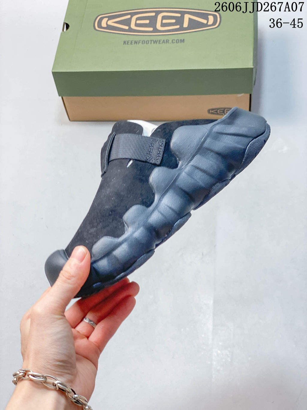 Side profile showing the sculpted sole, closed toe, and adjustable strap.