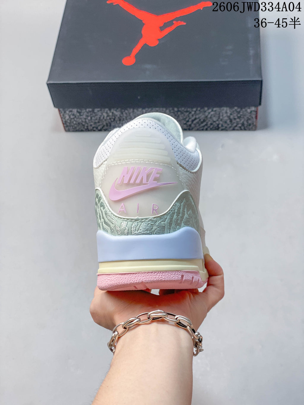 Rear view showing the patterned heel panel and pink heel branding