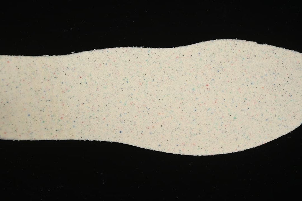 Light-colored shoe insole shown from above