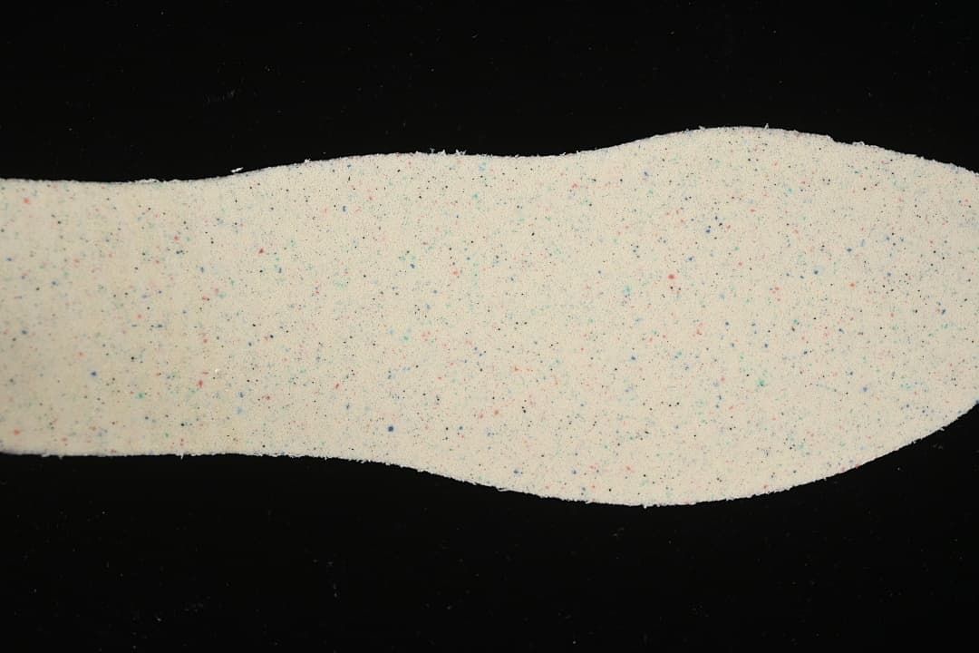 Light-colored shoe insole shown from above