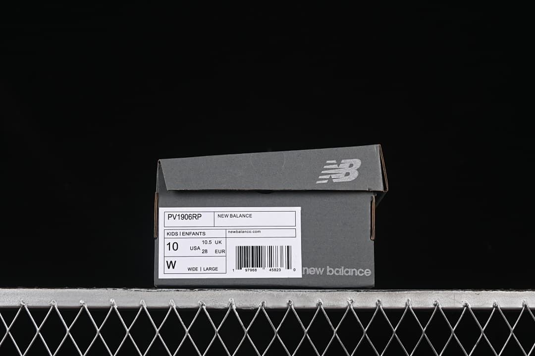New Balance shoe box label identifying model PV1906RP and showing US 10, UK 10.5, EU 28, and wide fit.