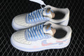 Pair of white and pale blue Nike Air Force 1 '07 low-top sneakers with braided blue-and-cream laces and pink side graphics
