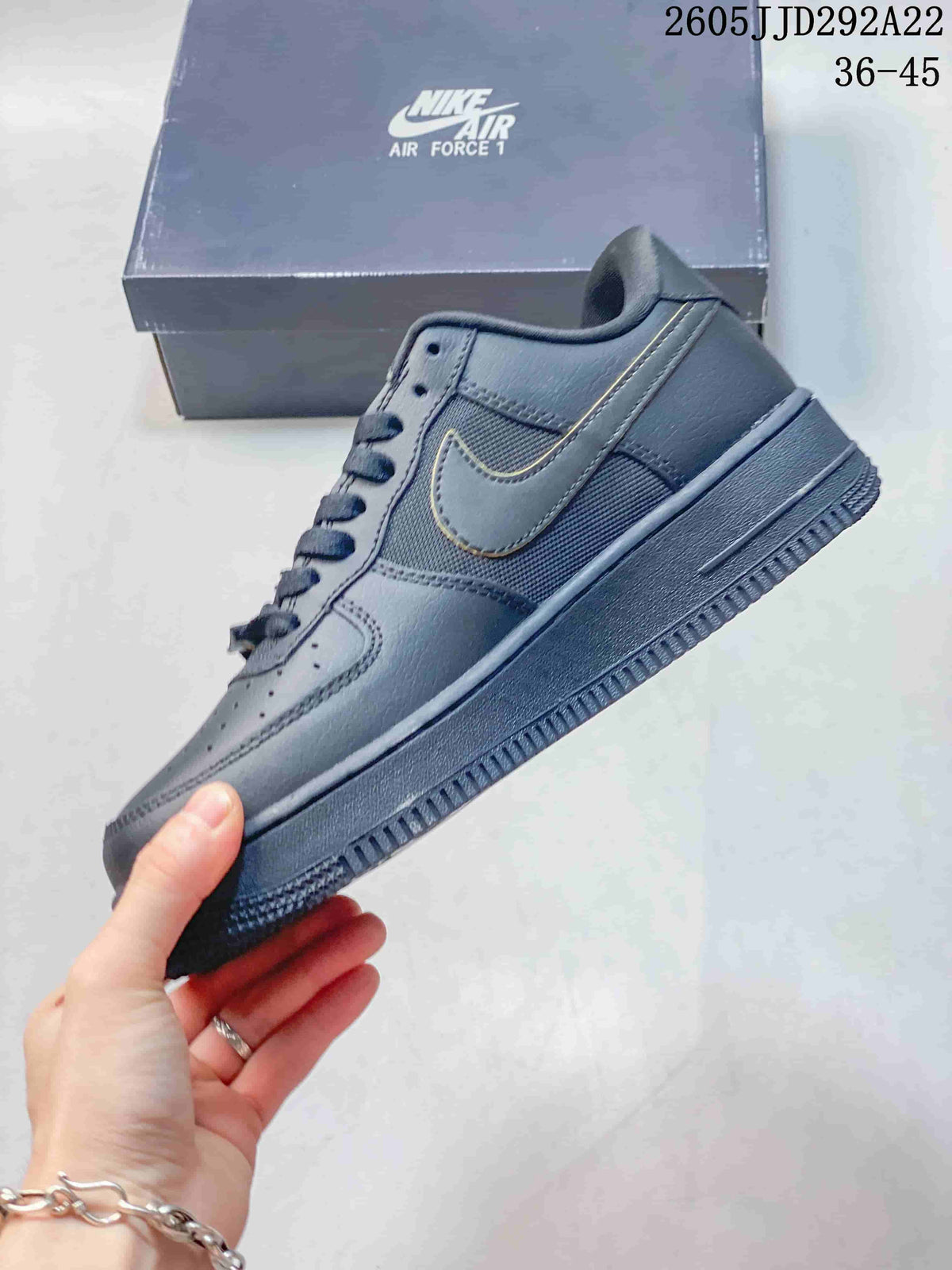 Side view highlighting layered panels, mesh insert, and Swoosh