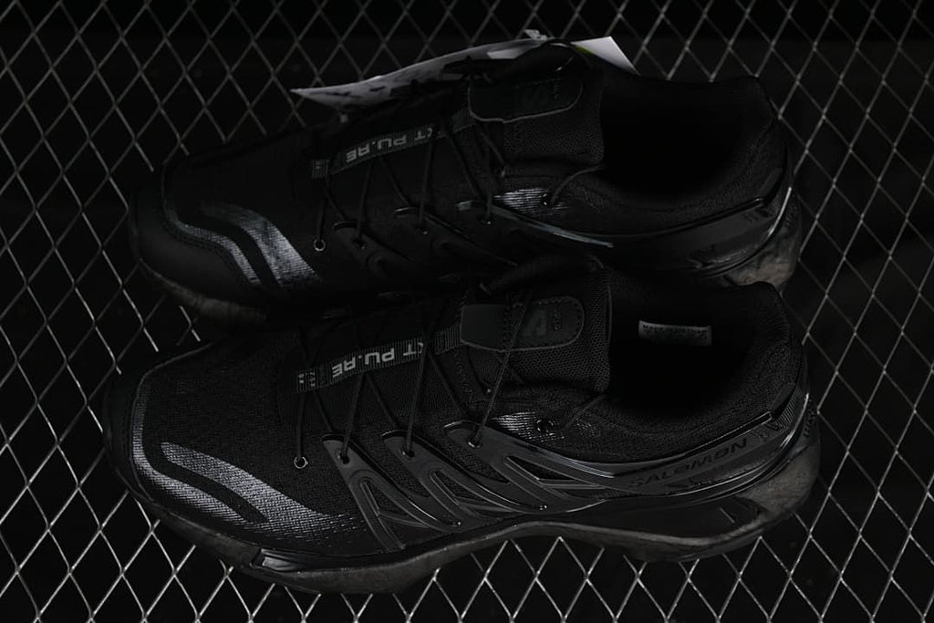 Pair of black shoes shown from above