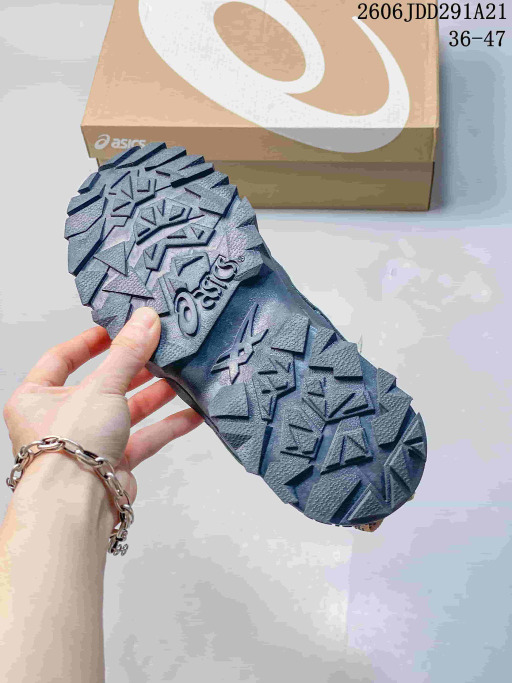 Close-up of the chunky, deeply treaded outsole