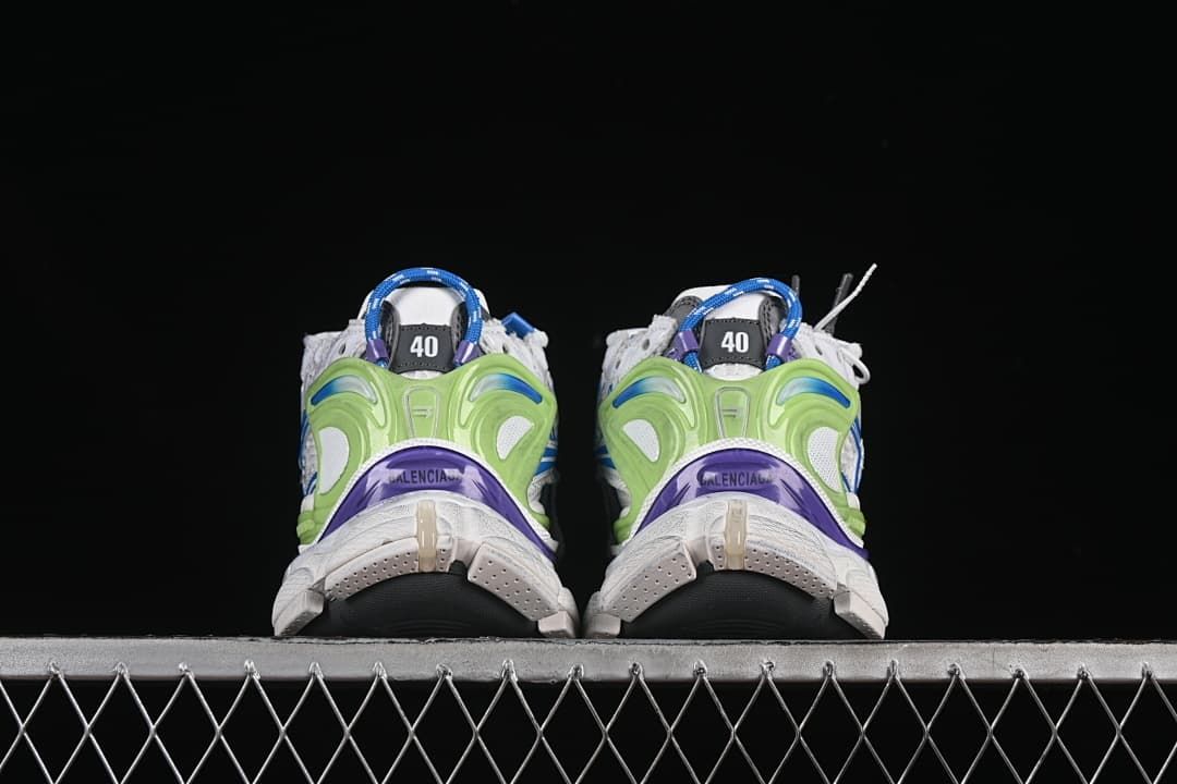 Rear view of the pair showing sculpted green heel supports and purple accents