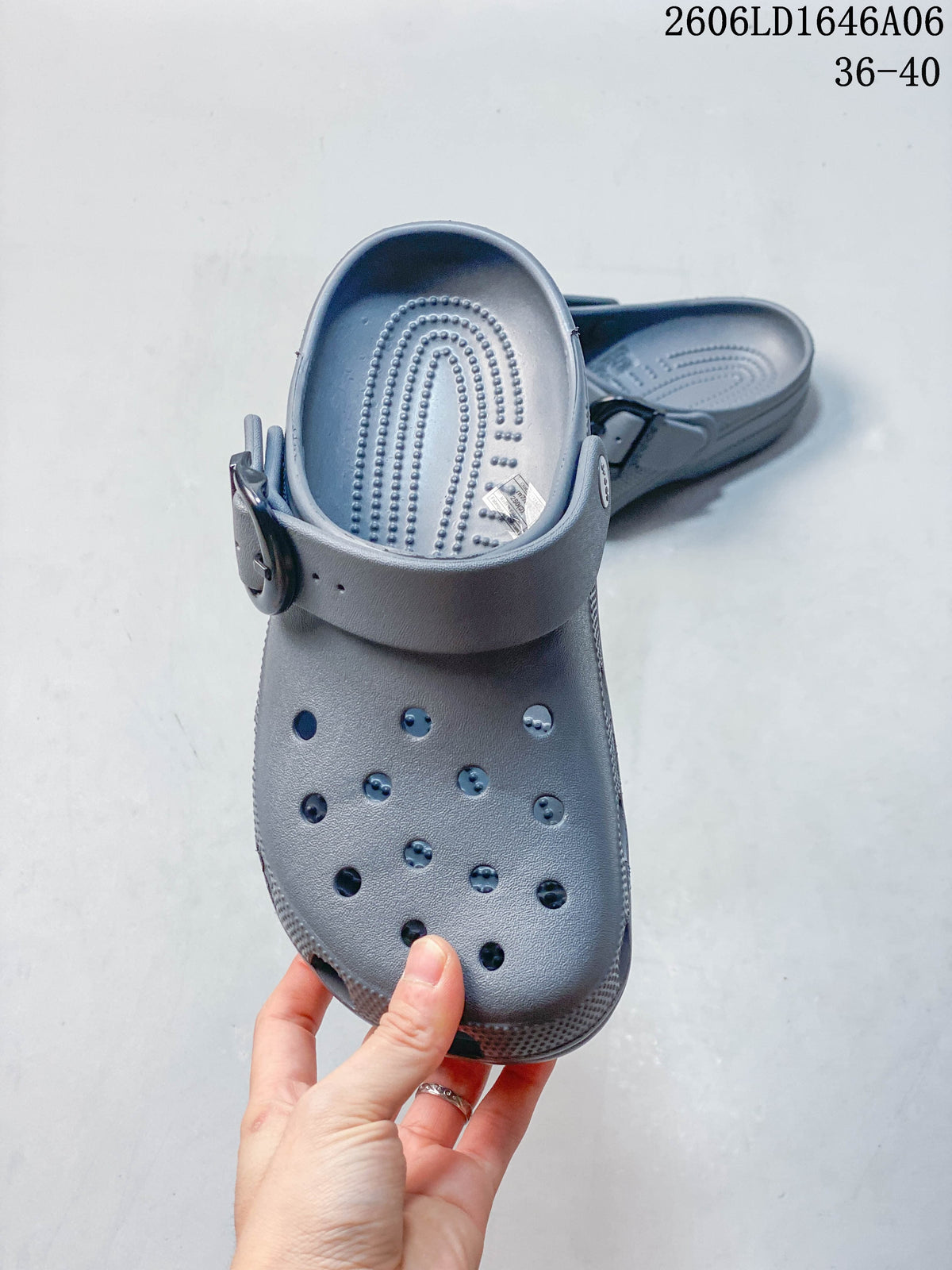 Top view of a gray clog showing its perforated upper, textured footbed and heel strap; image also displays size range 36–40.