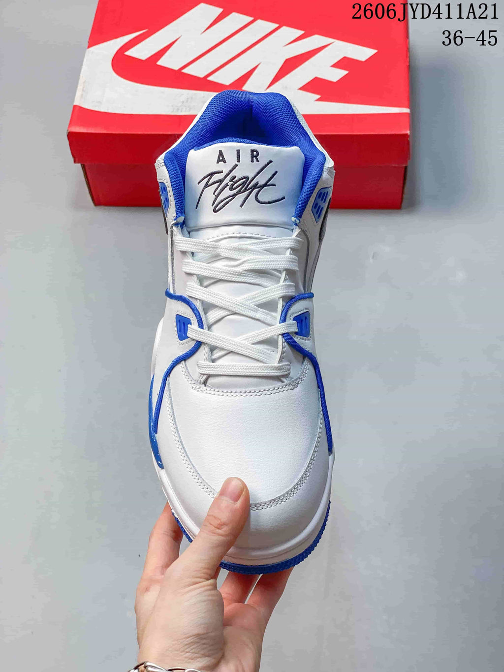 Front view showing laces, padded blue collar and Air Flight tongue branding