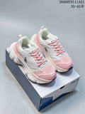 Pair of white and pink MLB NY chunky sneakers shown on a shoebox.
