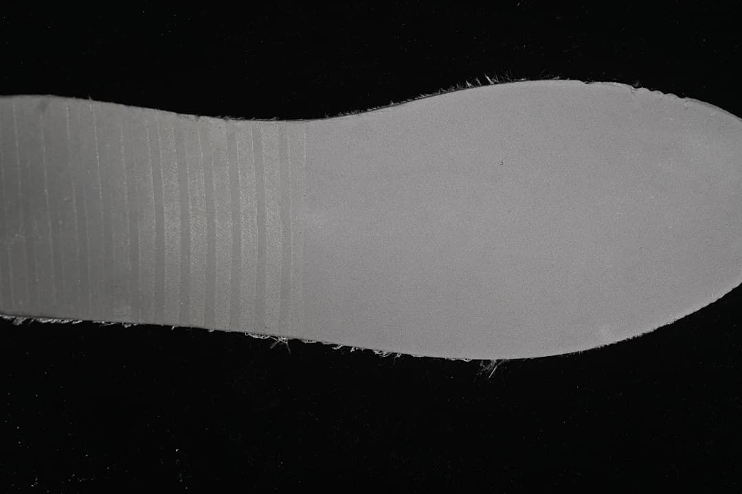 Close view of the sneaker’s light-colored outsole.