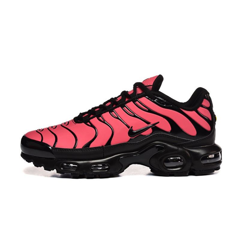 Pink and black Nike Air Max Plus sneaker with visible air units.
