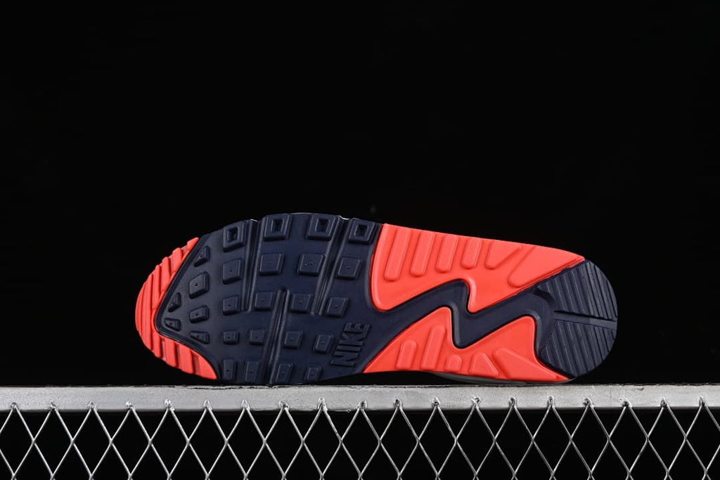 Underside view of the navy and red patterned outsole