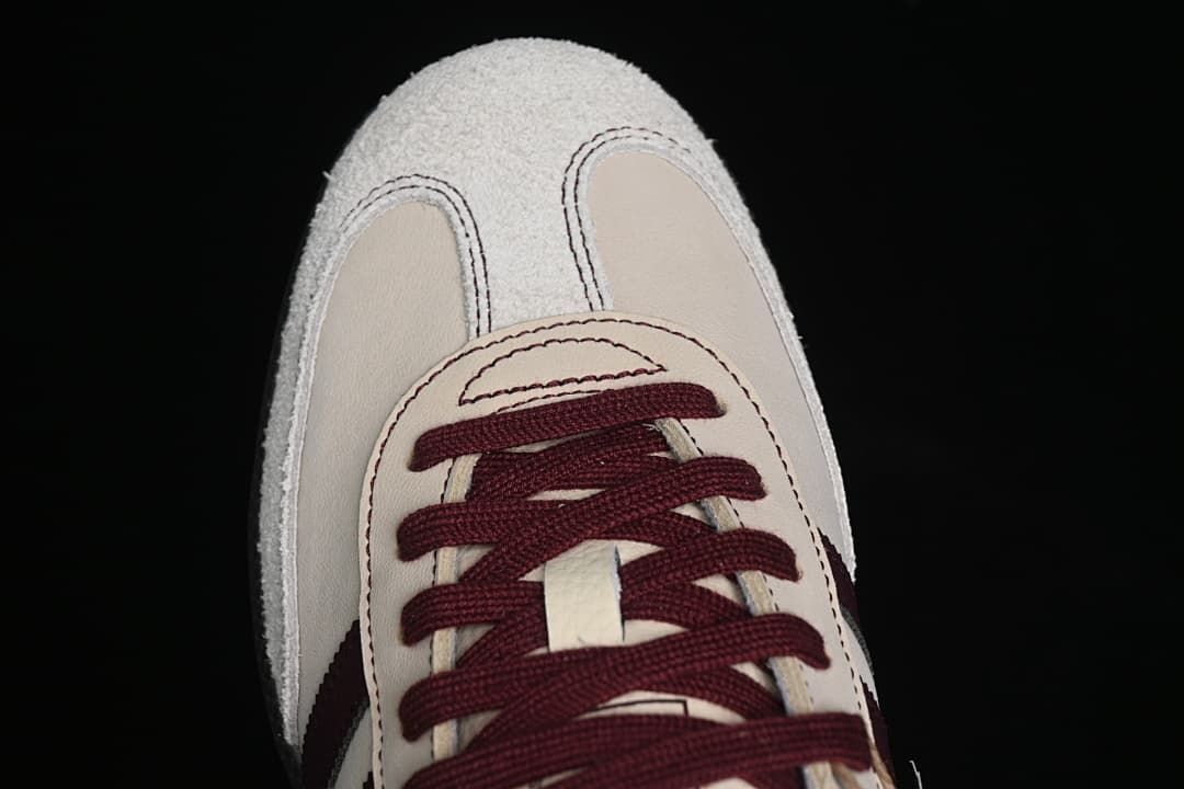 Top view of the sneaker’s toe and burgundy lacing.