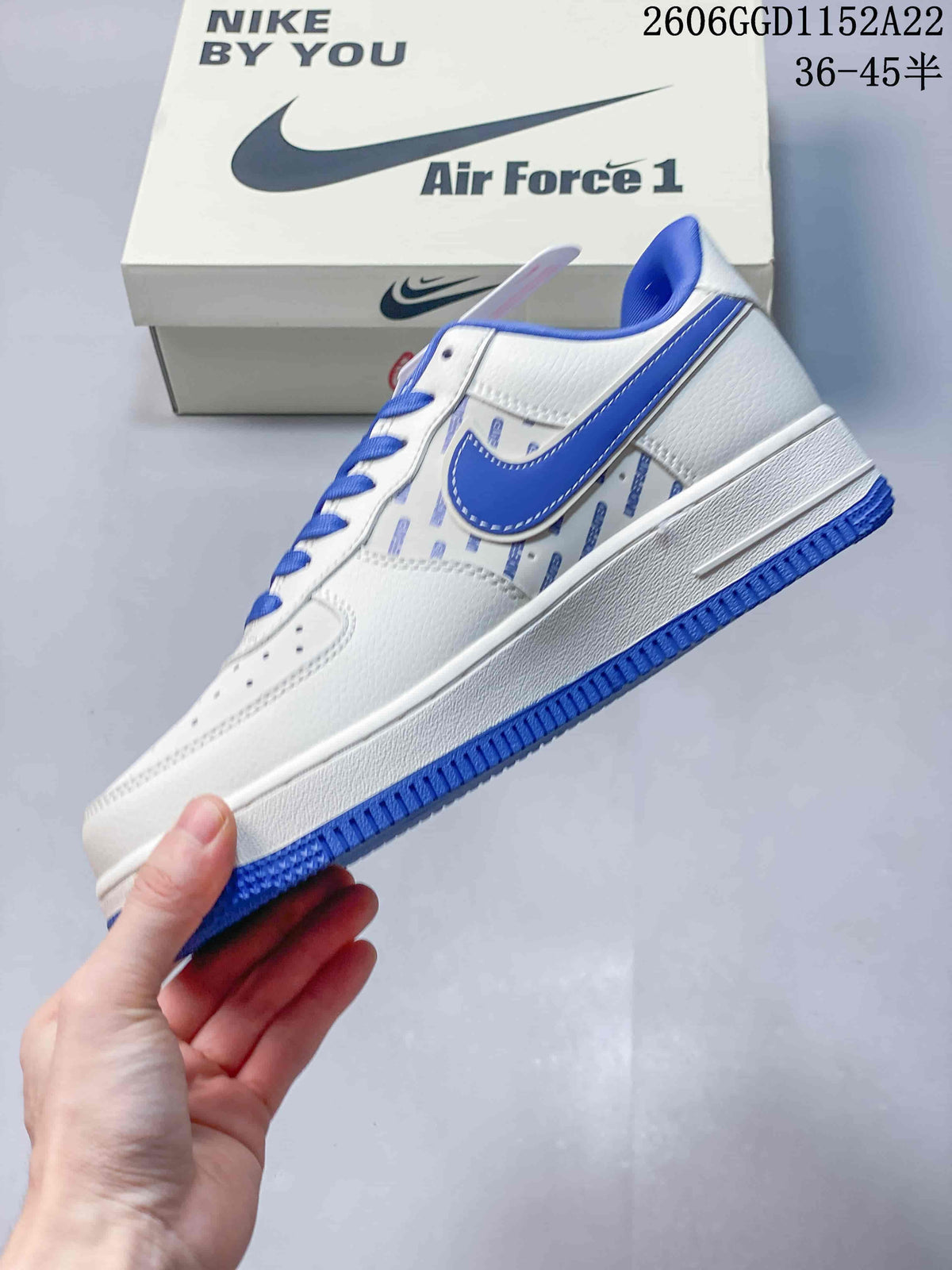 Side view showing the blue Swoosh-style panel and patterned side panels