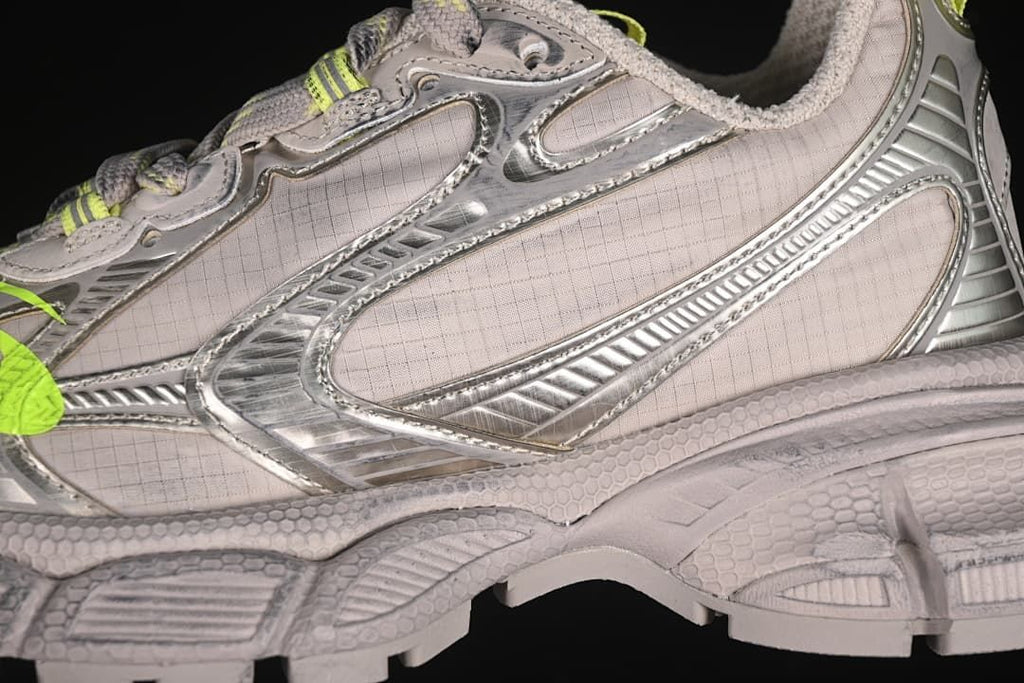 Close-up of the sneaker side panels and metallic-look overlays