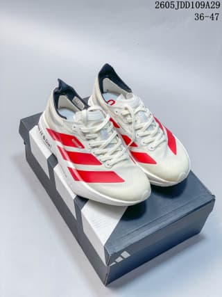 Pair of white and red Adidas Adizero Adios Pro 4 shoes displayed on an Adidas shoebox; the image also shows the size range 36–47 and code 2605JDD109A29.
