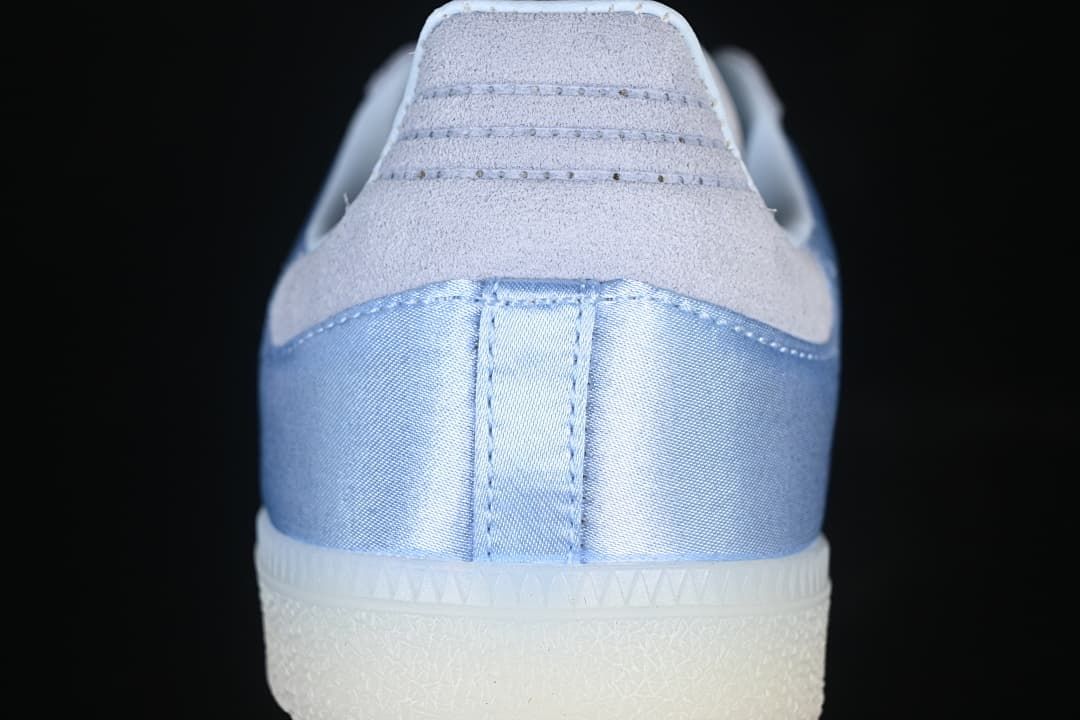 Rear view showing blue heel panel and gray suede-look heel tab