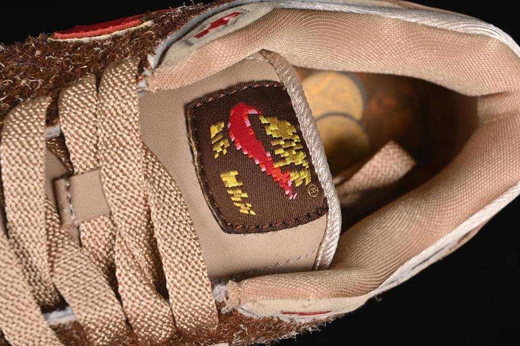 Close-up of the tongue label and tan laces.