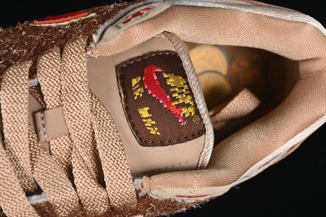 Close-up of the tongue label and tan laces.
