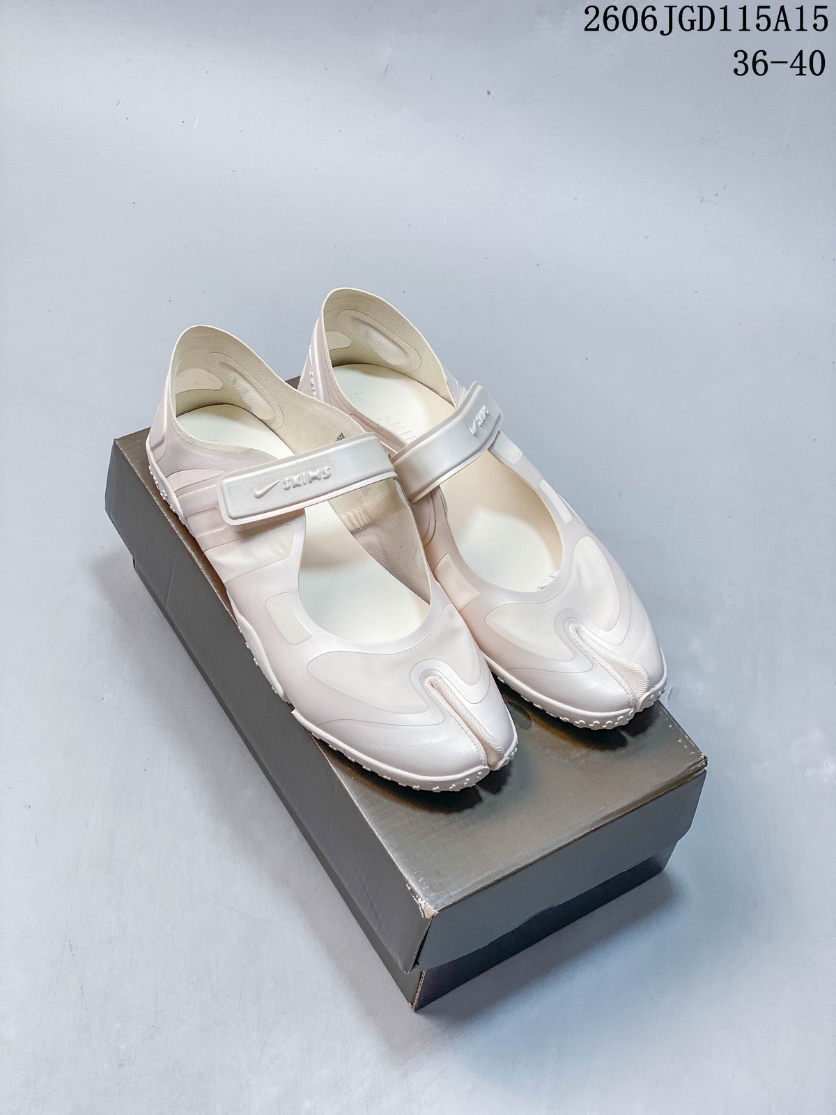 Pair of pale off-white Nike Air Rift shoes with split toes and adjustable straps