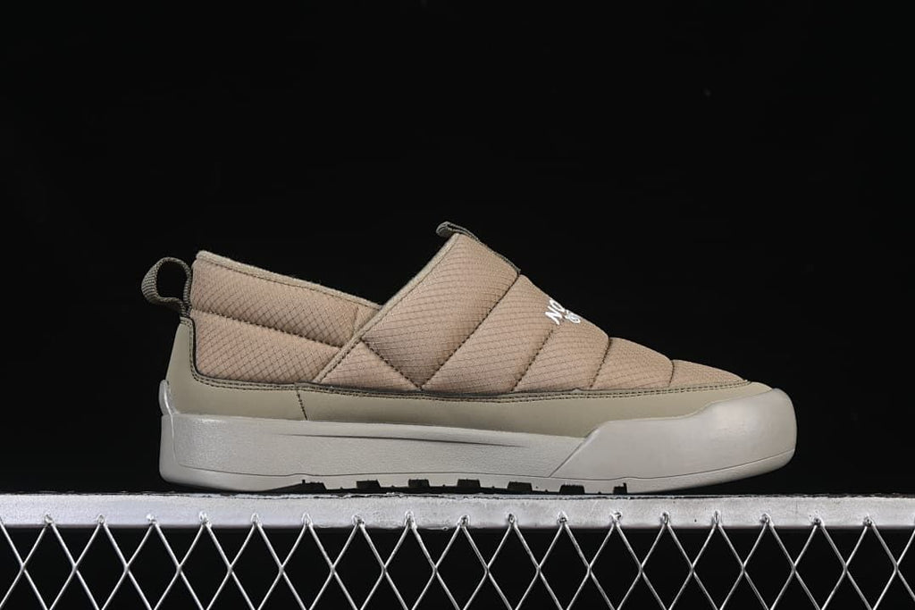 Side profile of the khaki slip-on shoe