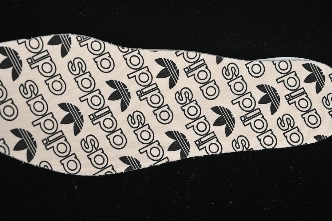 Close-up of the insole printed with adidas logos