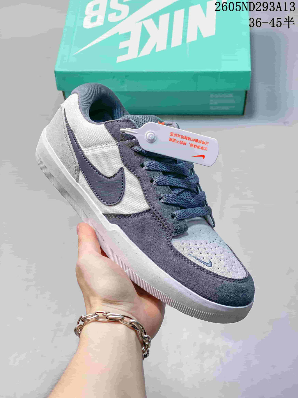 Grey and white Nike SB Force 58 sneaker with dark contrasting panels