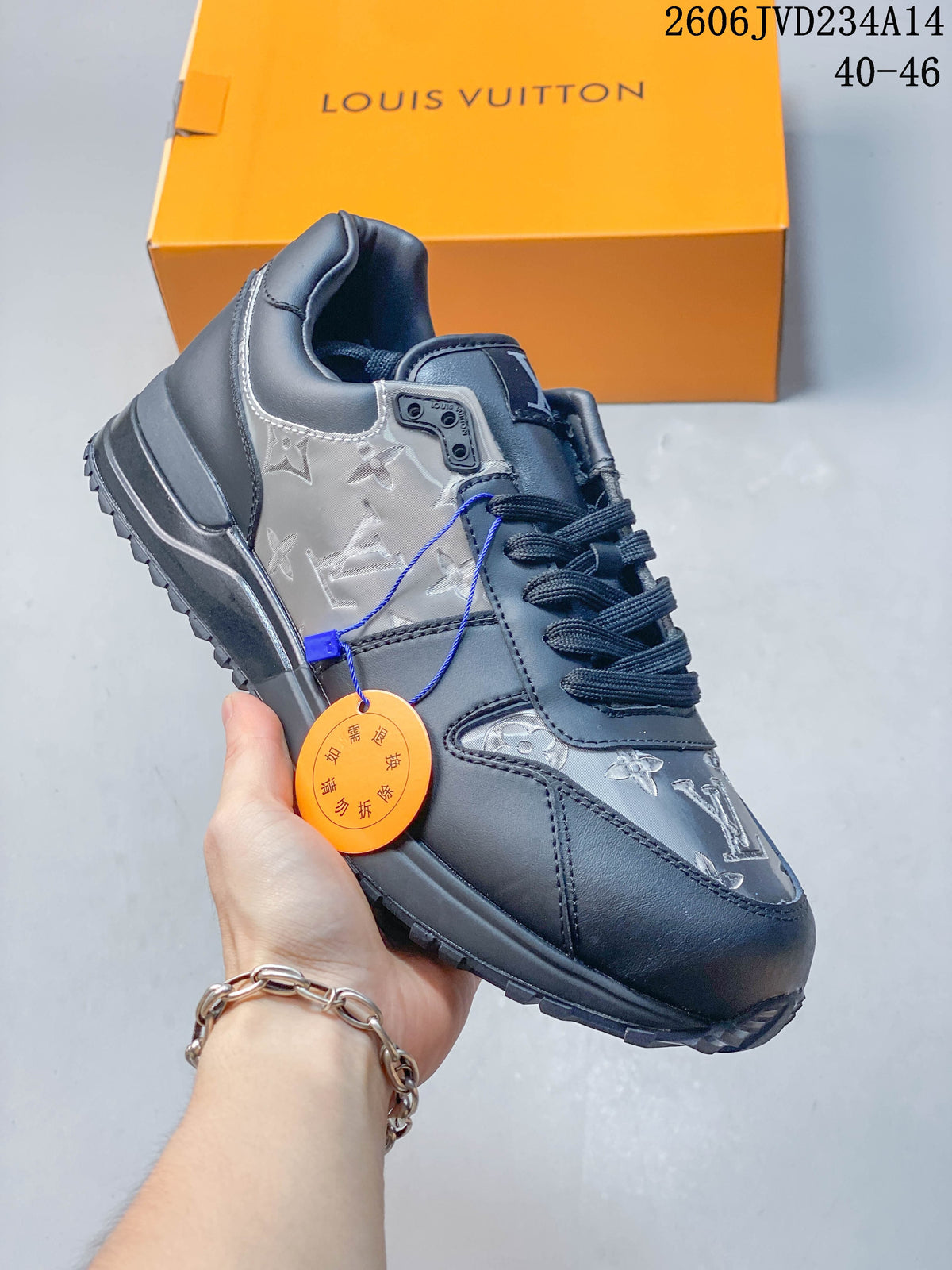 Angled view of the gray sneaker showing the side panel, laces, and patterned overlays