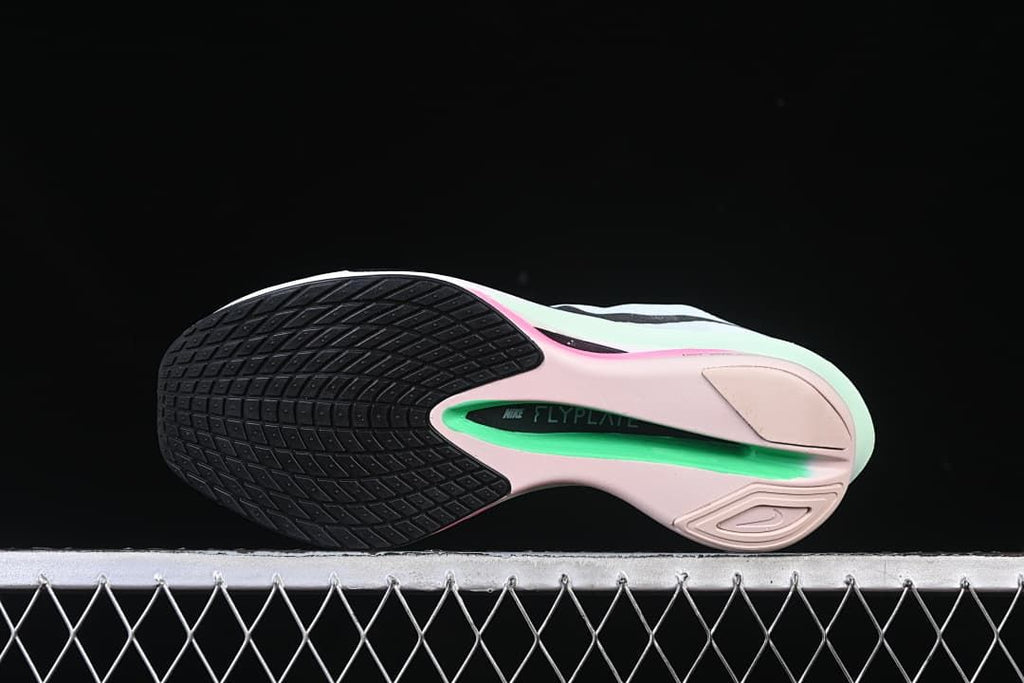 Underside view showing the black and pink-green outsole