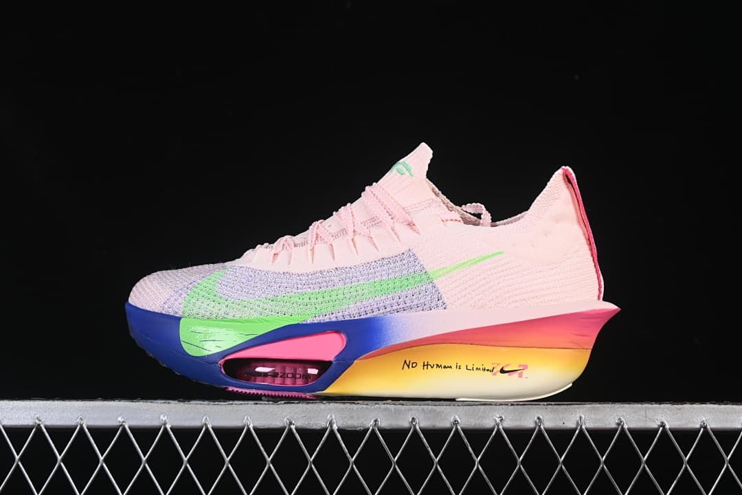 Side view of a pink Nike Zoom Vaporfly Next% 3 shoe with green accents and a multicolor sole