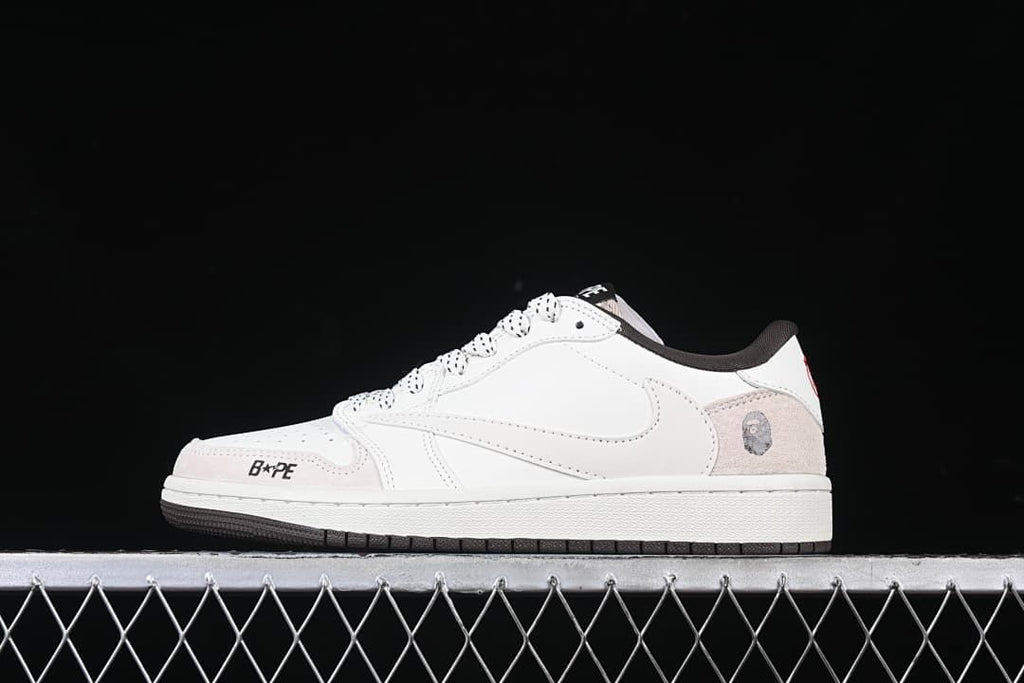 Side view of a white low-top sneaker with pale heel overlays and dark accents