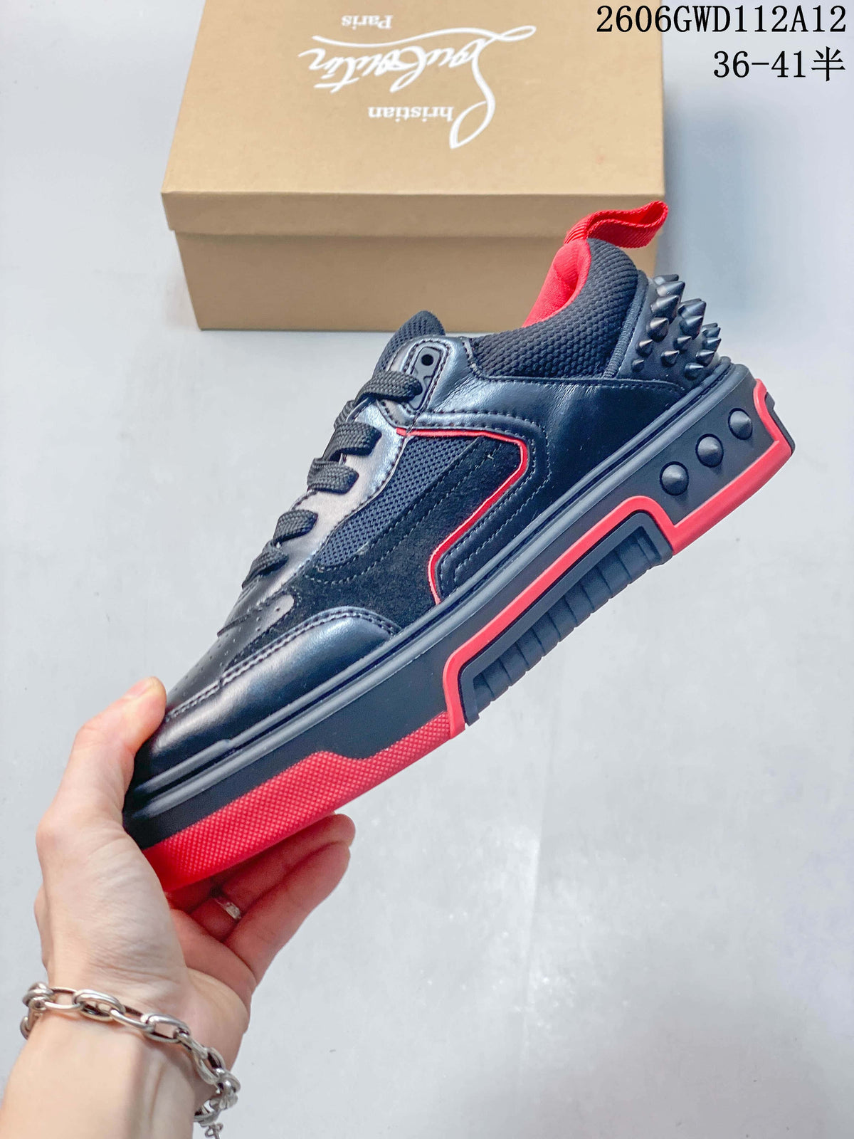 Side view of the black sneaker with red trim and a contrasting sole